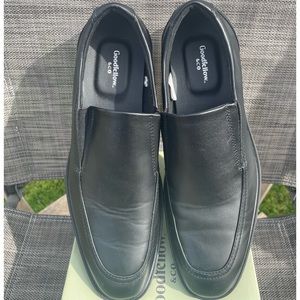 Men’s black dress shoe.